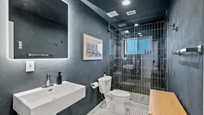 a bathroom with a sink and a toilet and a shower at Luxury Miami Waterfront Retreat with Private Dock in Golden Glades