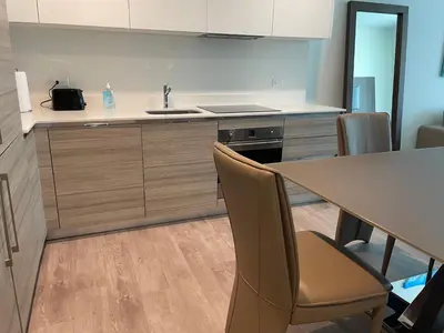 a kitchen with a table and chairs and a sink at Ocean Dream at Costa Hollywood in Hollywood