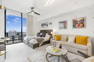 a living room with a couch and a table at Luxury Studio with Stunning City Views in Miami