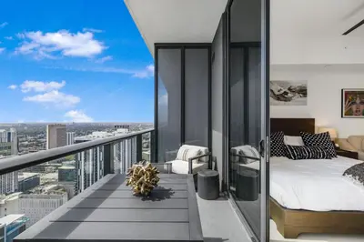 a bedroom with a bed and a view of the city at Luxury Studio with Stunning City Views in Miami