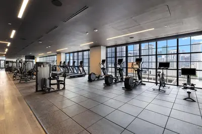 a gym with treadmills and exercise equipment in a building at Luxury Studio with Stunning City Views in Miami