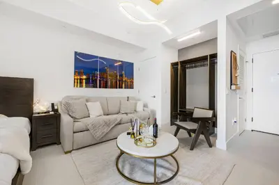 a living room with a couch and a table at Exclusive Studio with City Views in Downtown Miami in Miami