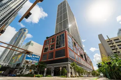 a tall building in the middle of a city at Exclusive Studio with City Views in Downtown Miami in Miami