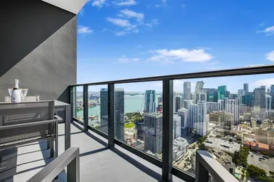 an apartment balcony with a view of the city at Exclusive Studio with City Views in Downtown Miami in Miami