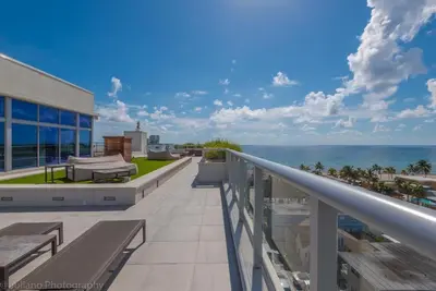 a balcony of a building with a view of the ocean at A Fantastic apart with balcony and partial view of the beach 4 Px in Hollywood