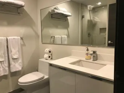 a bathroom with a sink and a toilet and a mirror at A Fantastic apart with balcony and partial view of the beach 4 Px in Hollywood