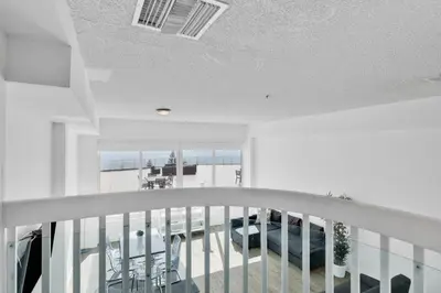a white balcony with a view of the ocean at Shine Suites Balcony Duplex 9 in Miami Beach