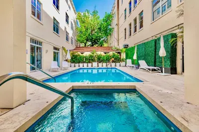 a swimming pool in the middle of a building at 2-Min to Beach, Upscale Enclave in Miami Beach