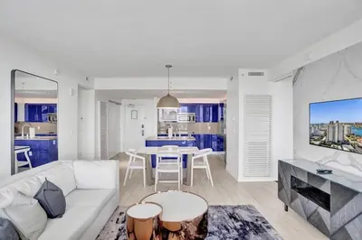 a living room with a white couch and a table at Luxury Beachfront Two Bedroom Condo - W Residences in Fort Lauderdale