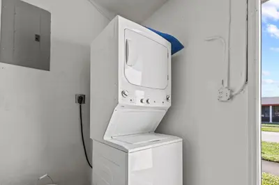 a white microwave oven sitting on top of a sink at Pool, golf & 4 mi. from the beach & The Hard Rock in Hollywood