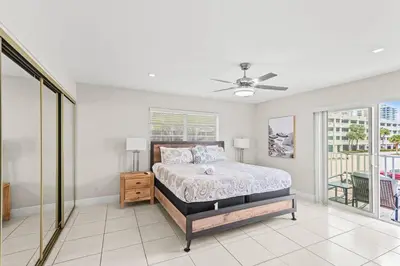 a bedroom with a bed and a ceiling fan at Beach, Pool & Las Olas Getaway in Fort Lauderdale