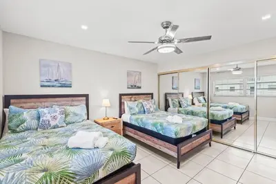 a bedroom with two beds and a ceiling fan at Beach, Pool & Las Olas Getaway in Fort Lauderdale