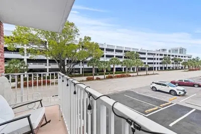 a balcony with a car parked in a parking lot at Beach, Pool & Las Olas Getaway in Fort Lauderdale