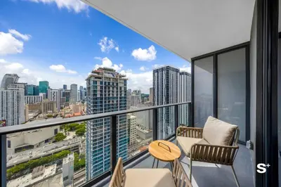 an apartment balcony with a view of the city at Studio in DTW Miami - City Views & Gym in Miami