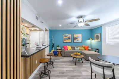 a living room with a couch and a table at One block from beach South Beach Ocean Dr-King Bed in Miami Beach