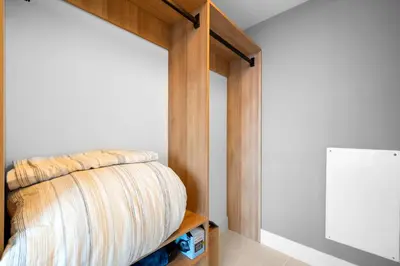 a closet with a wooden door with a blanket at From 43th Floor a Luxury Condo Awaits For You! in Miami