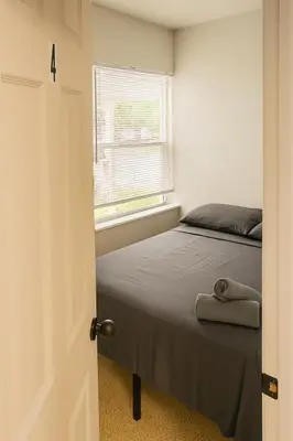 a bedroom with a bed and a window at The Awali in Miami