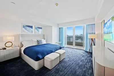 a bedroom with a bed and a large window at Ritz-Carlton Luxury Oceanfront 2BR on 16th Floor in Fort Lauderdale