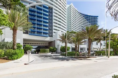 a large building with palm trees in front of it at 16th Floor Luxury 2 Bedroom - Ocean Views & Luxury in Fort Lauderdale