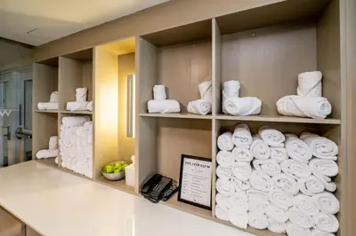 a room with towels on shelves in a bathroom at W Residences 2 Bed Unit - Beachfront and Luxe Stay in Fort Lauderdale