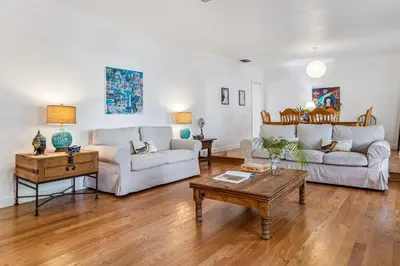 a living room with two couches and a coffee table at Tranquil Heirloom Hideaway Pool in South Miami in Miami