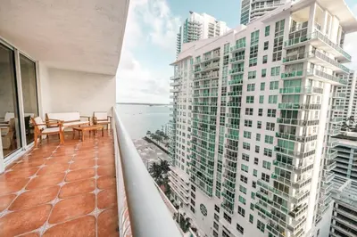 a balcony with a table and chairs on a building at Relax and stunning view 20th Floor Views in Miami