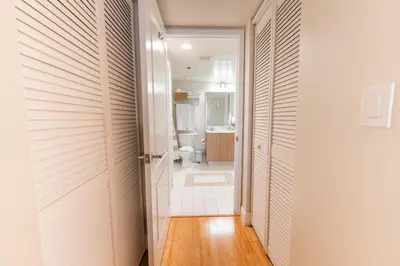 a corridor of a bathroom with a toilet and a door at Relax and stunning view 20th Floor Views in Miami