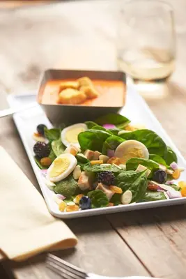 a plate of food with a salad on a table at Hyatt Place Miami Airport East in Miami