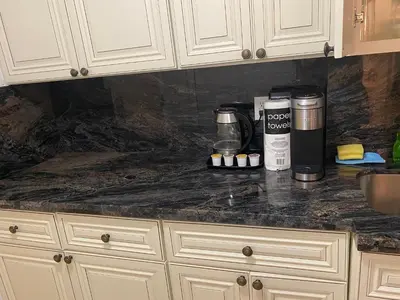 a kitchen counter with a coffee maker on it at All you need around you in Sunny Isles Beach