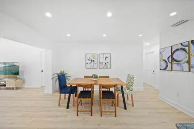 a dining room with a table and chairs at Miami Oasis- Pool & Game Fun in Miami