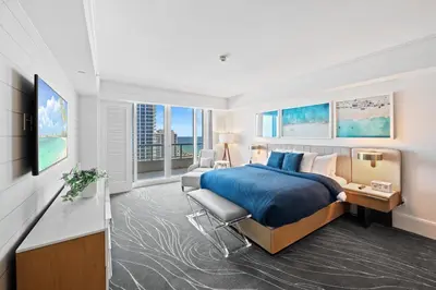 a hotel room with a bed and a television at Ritz-Carlton Luxury Oceanview 3-Bedroom Residence in Fort Lauderdale
