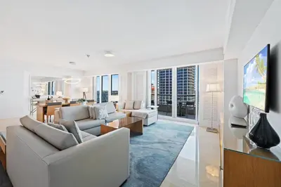 a living room with two couches and a dining room at Ritz-Carlton Luxury Oceanview 3-Bedroom Residence in Fort Lauderdale