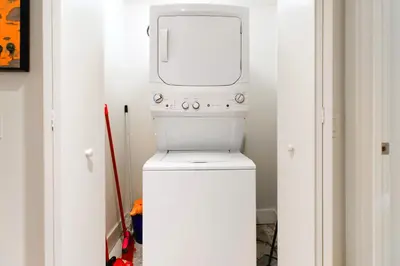 a white washer and dryer in a small bathroom at Live The Perfect Vacations in a Condo From The High in Hollywood