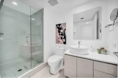 a bathroom with a shower and a toilet and a sink at Studio Beach Apmt 2 Full Q Beds, Amazing View in Hallandale Beach