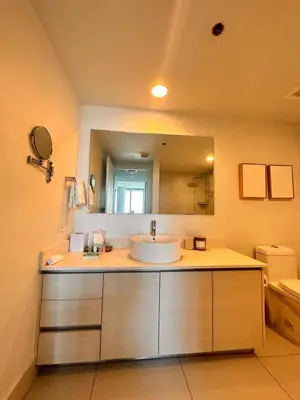 a bathroom with a sink and a large mirror at 1BR 1BA with Pool & Sun in Miami Beach in Hallandale Beach