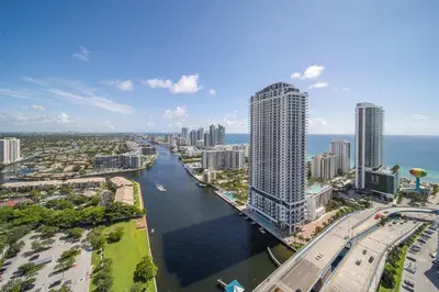 an aerial view of a city with a river and buildings at Perfect getaway beach pool and gym 2B 2B in Hallandale Beach