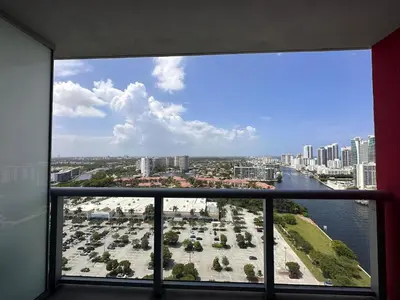 a view of a city from a window in a building at Perfect getaway beach pool and gym 2B 2B in Hallandale Beach