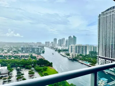a view of a river in a city with buildings at Perfect getaway beach pool and gym 2B 2B in Hallandale Beach