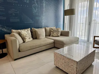 a living room with a couch and a coffee table at Hallandale Beach Apmt 1B 1B Beach & Pool Service in Hallandale Beach
