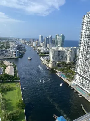 a river with boats in a city with buildings at Hallandale Beach Apmt 1B 1B Beach & Pool Service in Hallandale Beach