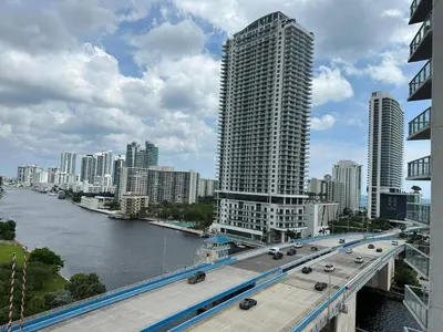 a bridge over a river in a city with buildings at Your Paradise in Miami Beach Gym and Pool 2b 2b 1507 in Hallandale Beach