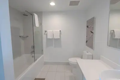 a white bathroom with a shower and a toilet at 2B 2B Beautiful Apt in Hallandale Beach with Beach Service 2605 in Hallandale Beach
