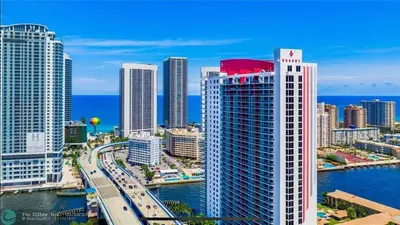 a view of a city with a river and buildings at Miami Apt with Gym Beach Service Pool on the water 2607 in Hallandale Beach
