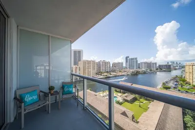 a balcony with views of the river and buildings at Enjoy Miami Beach Pool and Restaurant 2B 2B 2007 in Hallandale Beach