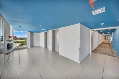 an empty room with a blue ceiling and white walls at Enjoy Miami Beach Pool and Restaurant 2B 2B 2007 in Hallandale Beach