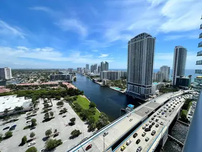 a view of a city with a bridge and a river at Charming 2 Bedroom Apt with Pool & Beach Service 2808 in Hallandale Beach