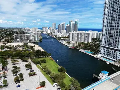 a view of a river in a city with tall buildings at Charming 2 Bedroom Apt with Pool & Beach Service 2808 in Hallandale Beach