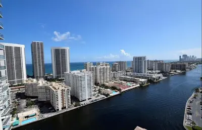 an aerial view of a city with a river and buildings at Beachfront Studio, 2 Full Beds, Dream View 2804 in Hallandale Beach