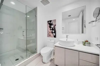 a bathroom with a toilet and a sink and a shower at Beachfront Studio, 2 Full Beds, Dream View 2804 in Hallandale Beach
