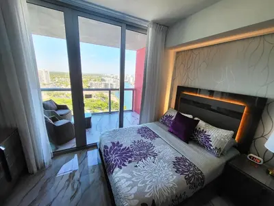 a bedroom with a bed and a large window at 2b 2b Apmt Hallandale Beach 2805 in Hallandale Beach